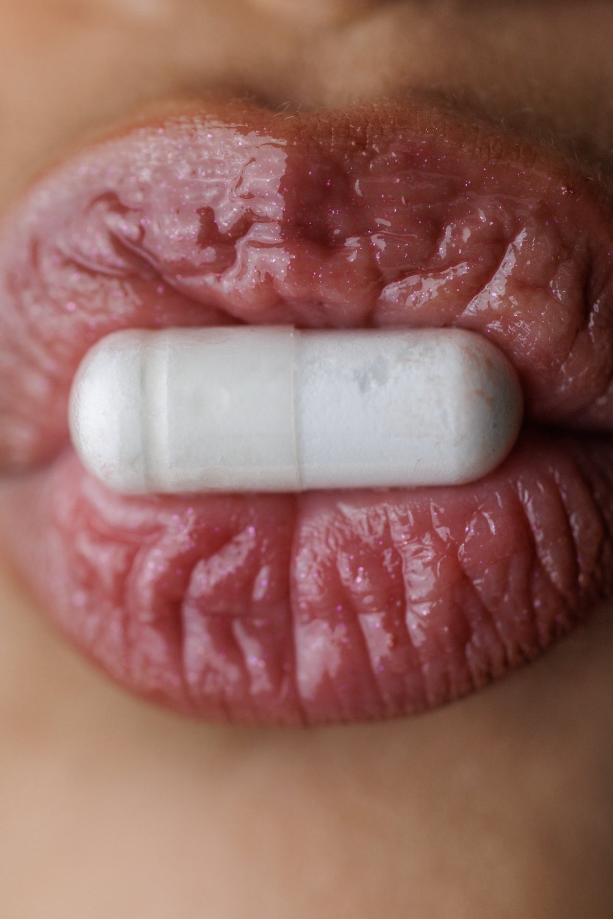 Close up of mouth with a pill